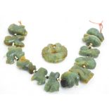 A Chinese carved jadeite bead decorative hanging,