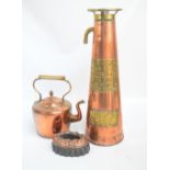 A copper and brass fire extinguisher of tapering form with embossed plaque reading "The Langbridge
