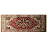 A red ground Heriz rug, 190 x 140cm.