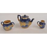 A late 19th century Doulton Lambeth stoneware three piece tea set mould decorated with a continuous