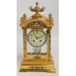 A 19th century French gilt brass and champlevé enamel decorated four glass eight day mantel clock,
