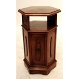 A walnut hexagonal side cabinet, the top and undertier above single two panelled doors,