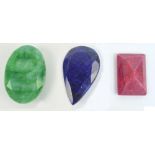 Three faceted loose stones; a Brazilian emerald, 35cts, an African ruby,