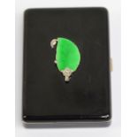 CARTIER; a silver gilt black enamelled jade and diamond compact of rounded rectangular form,