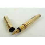 A gold plated "Swan Pen" fountain pen with engine turned decoration and 14ct yellow gold nib,