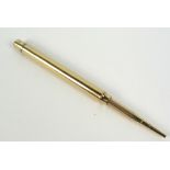 SAMPSON MORDAN & CO; a 9ct yellow gold propelling pencil of plain form, hallmarked for London 1923,