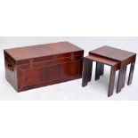 A large contemporary leather clad trunk with twin carrying handles and a nest of two matching