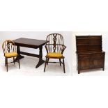 A 1940s dark oak Ercol style rectangular table, 71 x 114cm, a set of five chairs (4+1),