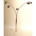 An early to mid 20th century chromed metal floor lamp with five circular lamps on curved stems