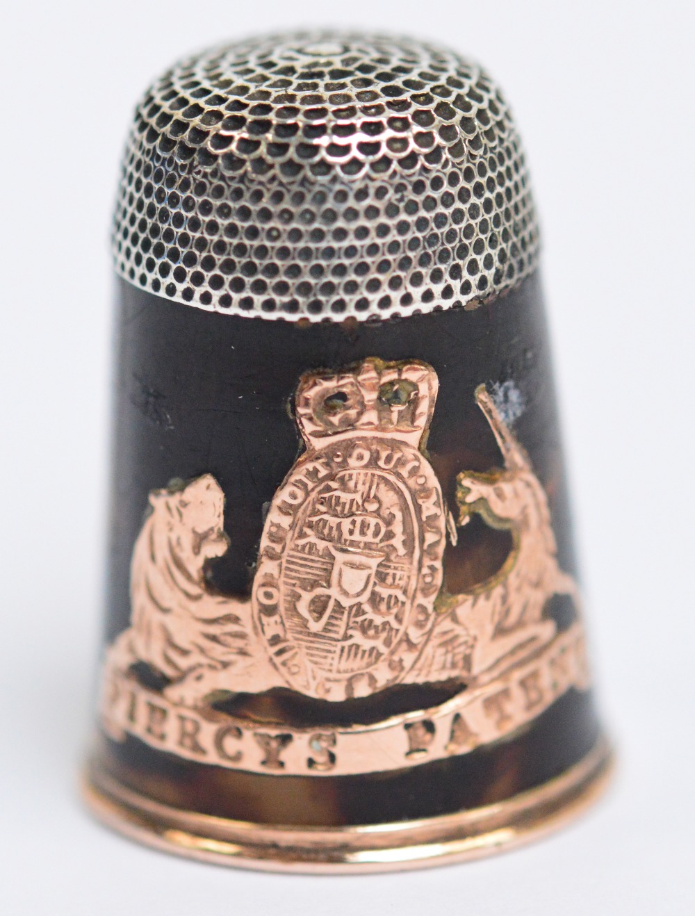 A cased 19th century tortoiseshell and gold "Piercy's Patent" thimble, length 2.3cm.