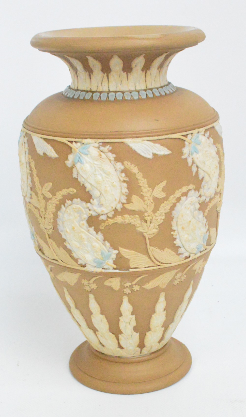 A Doulton Lambeth Silicon brown glazed relief moulded baluster vase decorated with paisley style