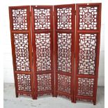 A 20th century Chinese pierced rosewood four section screen, total width approx 160cm.