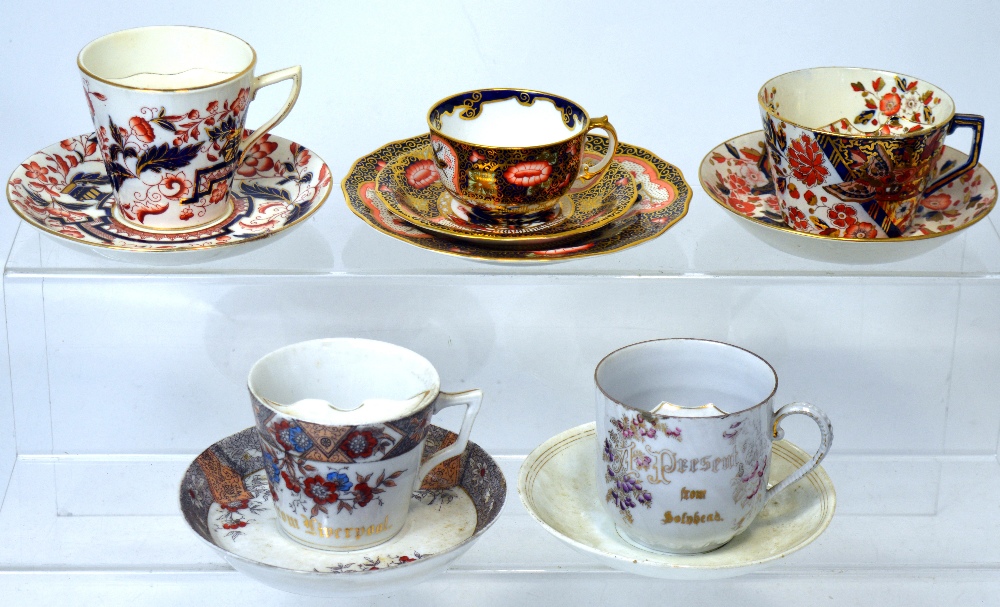 Four moustache cups and saucers to include an Old Derby example (af) and a Royal Crown Derby trio