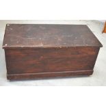 A rectangular wooden chest with metal handles on plinth base, length 110cm.