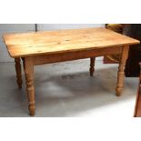 A rustic rectangular pine kitchen table, width 153cm.