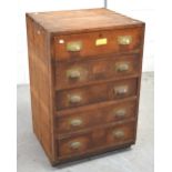 An early 20th century oak and pine five drawer chest of drawers,