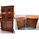 A reproduction four drawer serpentine fronted chest of drawers on bracket feet, width 70cm,