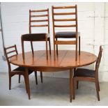 A retro G-Plan teak extending oval dining table on rounded tapering legs,