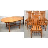 An Ercol Windsor oval extending dining table,