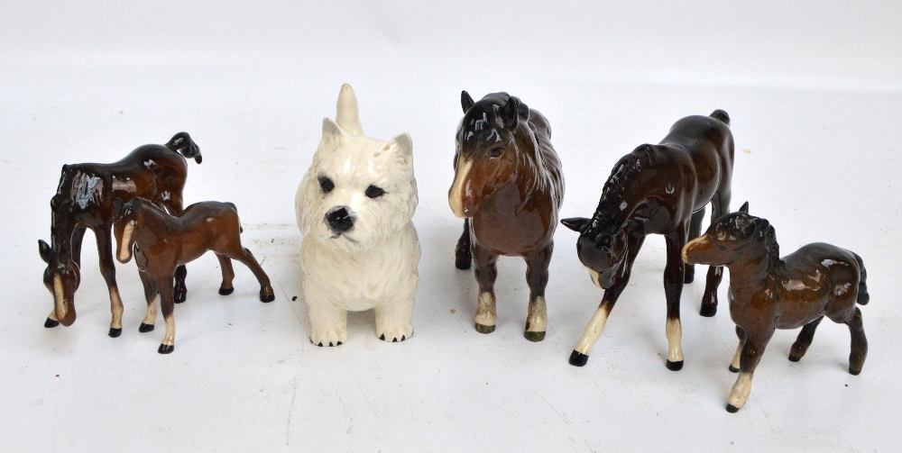A collection of Beswick animals comprising a woolly Shetland mare, a Shetland foal,