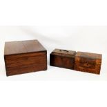 A Georgian mahogany tea caddy, the hinged inlaid detailed lid enclosing sectioned interior,