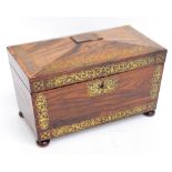 A Regency rosewood and brass inlaid tea caddy of sarcophagus form, lacking interior.