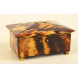 A 19th century tortoiseshell trinket box of rectangular form with vacant cartouche to the hinged