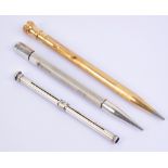 A hallmarked silver propelling pencil of hexagonal form with engine turned decoration, by JM & Co,