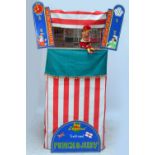 A full size Punch and Judy tent with board announcing "Prof.