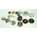 A collection of compacts including a floral decorated boxed example by Stratton,