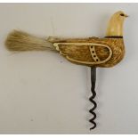 A carved antler corkscrew/brush, modelled as a bird with horn details and pen work to the wings,