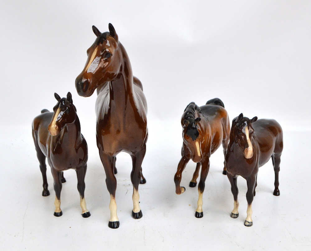 Four large brown Beswick horses, including large Quarter Horse, height 29.
