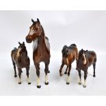 Four large brown Beswick horses, including large Quarter Horse, height 29.