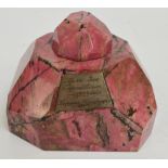 An early 20th century faceted pink/rose quartz inkwell of shaped form, with cover,