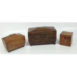 A late 19th/early 20th century mahogany sarcophagus tea caddy centred with a starburst ornament to