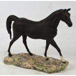 A large Beswick matt black figure of a horse on naturalistic moulded plinth, printed marks to base,
