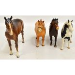 Four Beswick figures of horses; a piebald Pinto Pony, a Norwegian Fjord Horse,