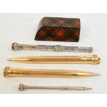 A pair of gold plated "Eversharp" American propelling pencils with engine turned decoration,