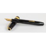 A Conway Stewart 100 fountain pen with black body and 14ct yellow gold nib, length 14cm.