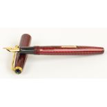 A Conway Stewart 93 fountain pen with red herringbone decorated body and 14ct yellow gold nib,