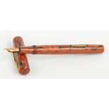 A Conway Stewart "The Conway Stewart" fountain pen with simulated wood body and 14ct yellow god nib,