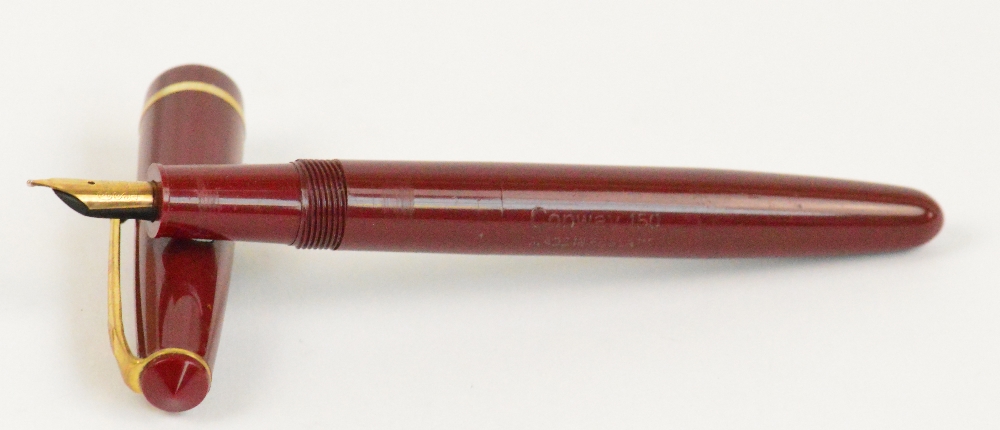 A Conway Stewart "Conway 150" fountain pen with maroon body and 14ct yellow gold nib, length 13.3cm.