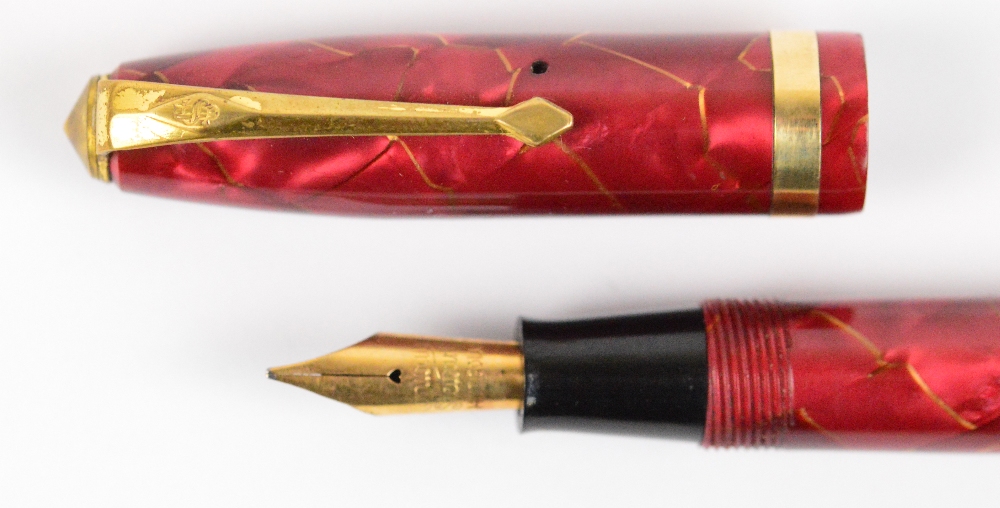 A Conway Stewart 84 fountain pen in gold veined rose coloured body with gold plated trim, length 11. - Image 3 of 3