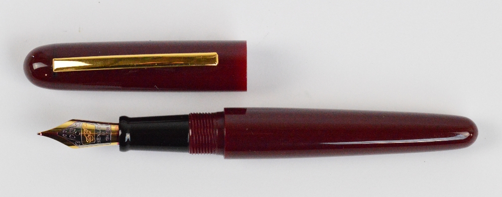 A Bexley red bodied fountain pen with 18ct two tone gold nib, length 13.8cm. - Image 2 of 4