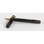 A Conway Stewart no.35 fountain pen with brown body and 14ct yellow gold nib, length 13.2cm.