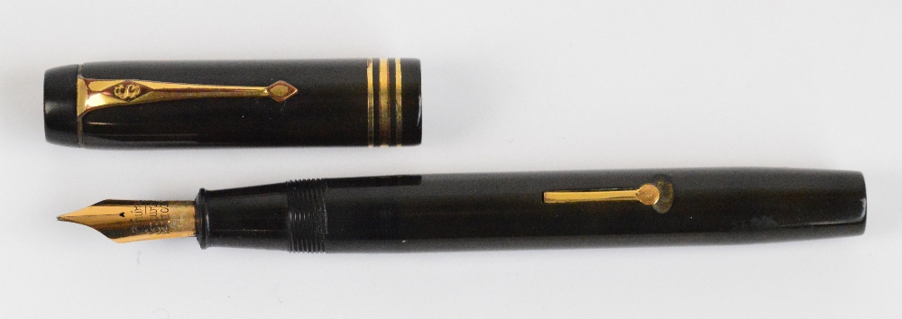 A Conway Stewart no.35 fountain pen with brown body and 14ct yellow gold nib, length 13.2cm. - Image 2 of 3