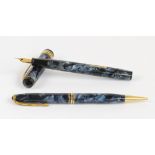 A Conway Stewart 388 fountain pen with blue marbled body and 14ct yellow gold nib, length 12.