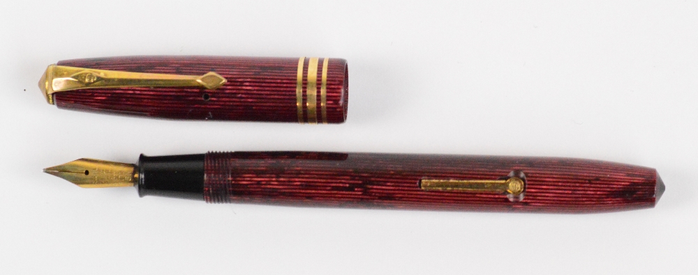 A Conway Stewart 36 fountain pen with maroon vertical striped body and 14ct yellow gold nib, - Image 2 of 3