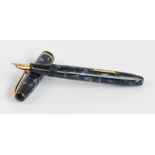 A Conway Stewart 15 fountain pen with blue marbled body and 14ct yellow gold nib,