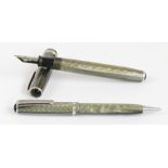 An Esterbrook fountain pen and pencil set in grey/light green pearl body,